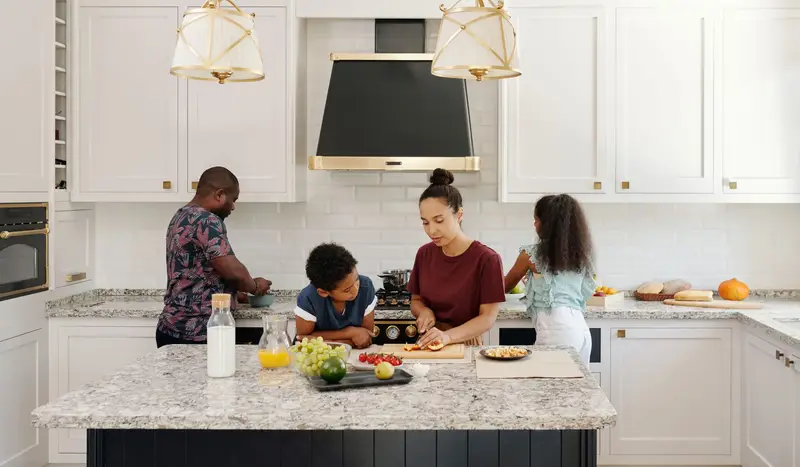 Family cooking together in a modular kitchen