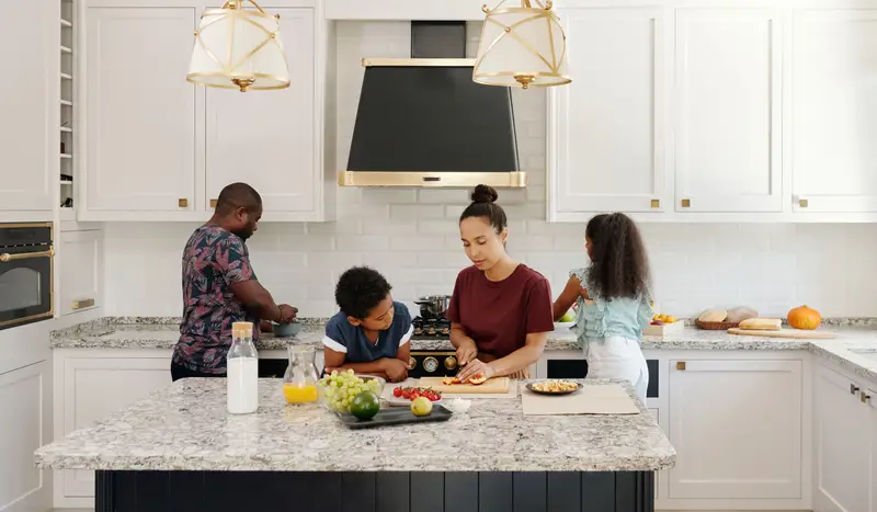Family cooking together in a modular kitchen