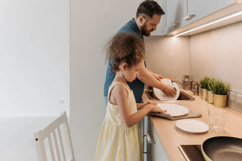 Father and daughter in a modern kitchen